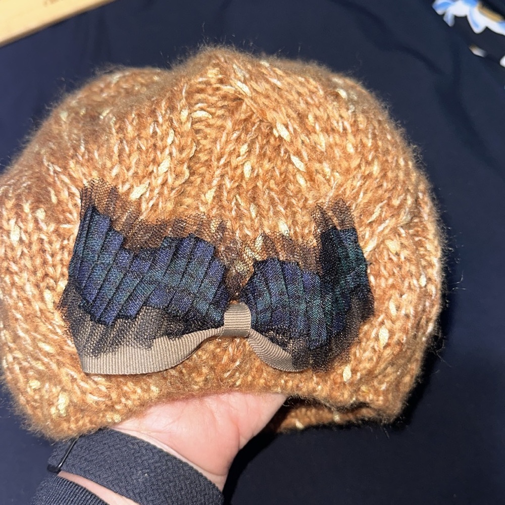 Beautiful beanie rust and gold with bow on the front